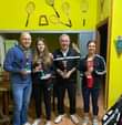 Potrebbe essere un'immagine raffigurante 4 persone, persone che giocano a tennis e testo